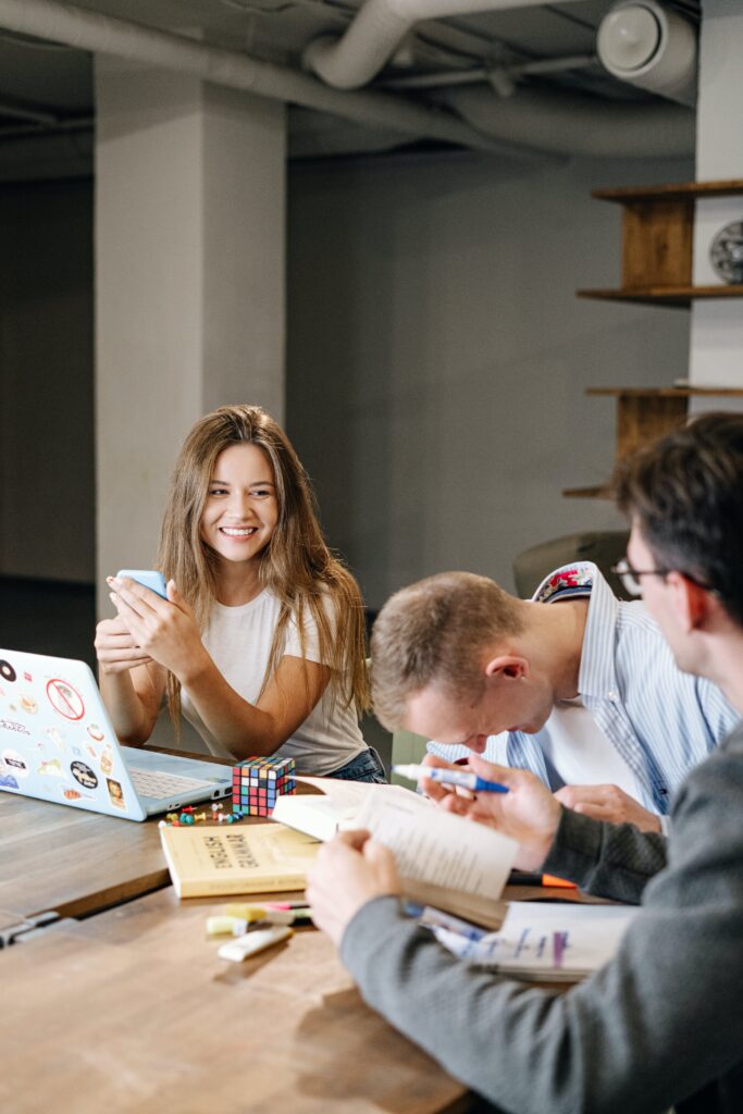 Woman Happily looks at her Colleague